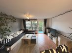 Vermietetes Mehrfamilienhaus mit Garten, einer Garage und 3 Carports in Knittlingen - Wohnzimmer - Whg. EG